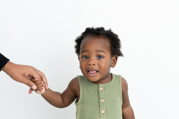 Baby holding his mom's hand