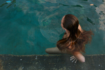 Women having fun inside the pool