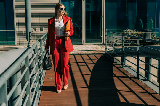 Businesswoman walking towards the camera on the street
