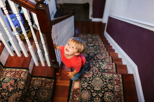 Kid Walking Up Stair At Home