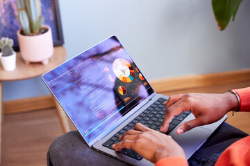 Cropped image of black designer working on computer