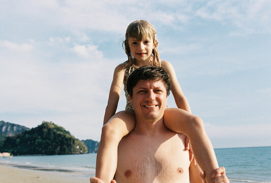 Father with daughter on the beach