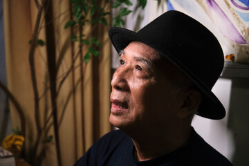 Closeup portrait of handsome and lovely old Asian man