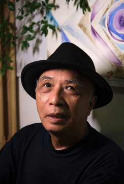 Closeup portrait of handsome and lovely old Asian man