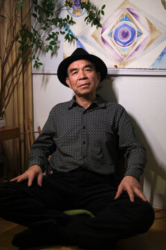 Closeup portrait of handsome and lovely old Asian man