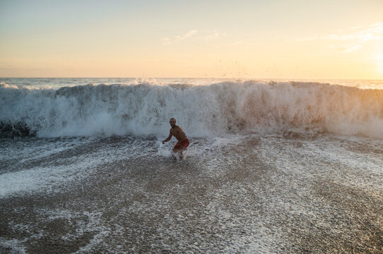 Lonely man swimming at the beach
