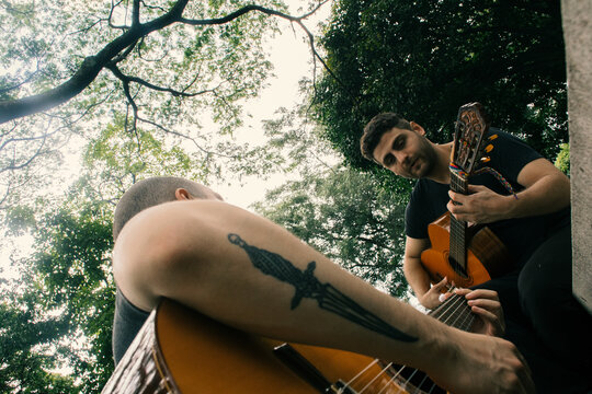 Man playing guitar in nature
