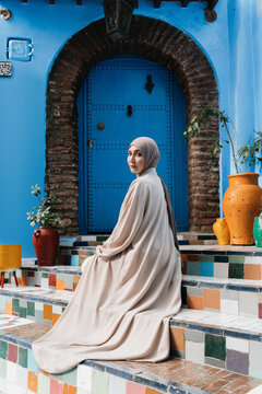 Artistic Image of  Muslim Woman on Colorful Stairs