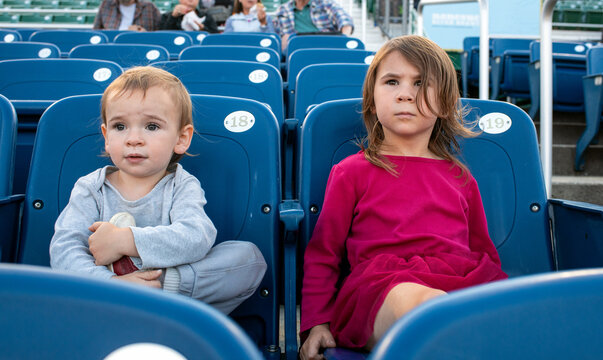 Children Watching a Professional Baseball Game from Bleacher Seats