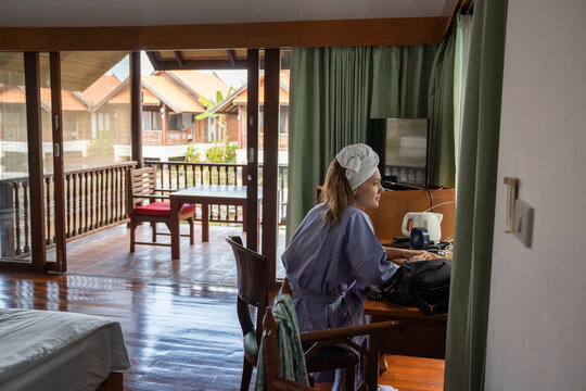 Woman In Hotel Room In The Morning