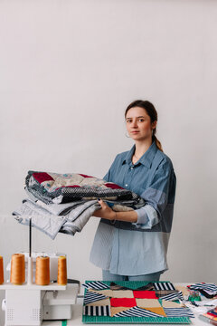 Cheerful female designer working in atelier