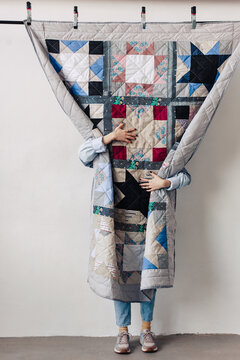 Upcycling designer woman with decorative patchwork blanket