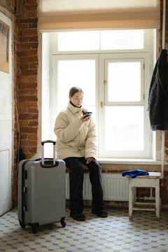 girl waiting for a taxi at home 
