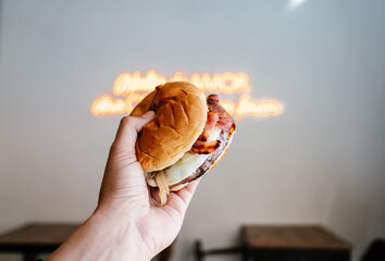 Anonymous man holding a delicious burger