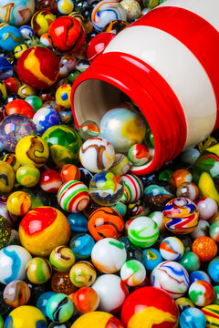 Red And White Jar With Marbles