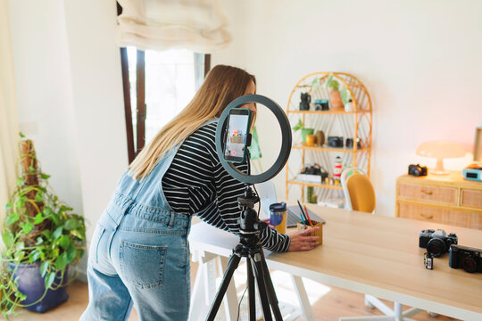 Woman preparing a set for filming