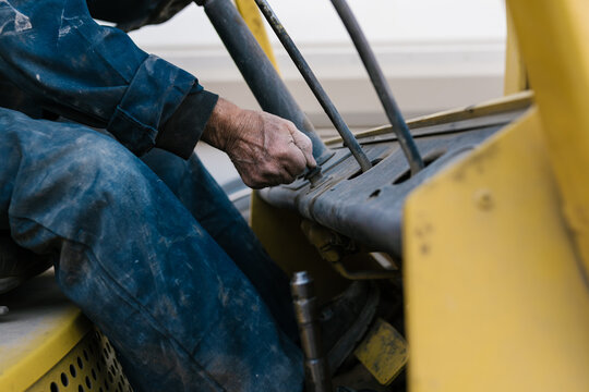 Crop forklift truck driver operating industrial transport