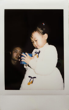 Children playing with Rubik's Cube, Polaroid