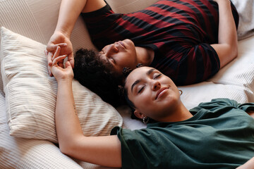 Young couple cuddling in the sofa