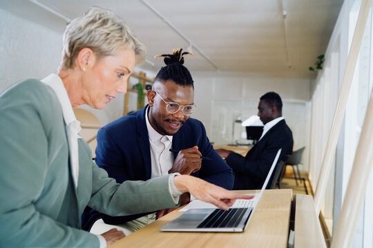 Colleagues working together in an office space