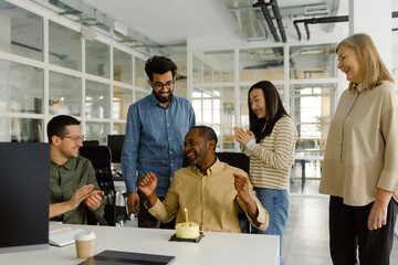 Cheerful multiracial colleagues celebration meet