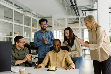 Diverse colleagues celebrating birthday together office 