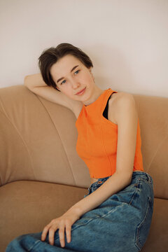 Young woman sitting on a safa