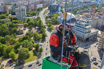 Rope access. Cleaning the windows of the skyscraper.