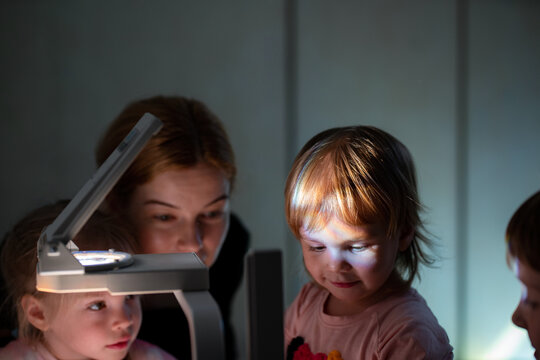 kids playing  light and projector