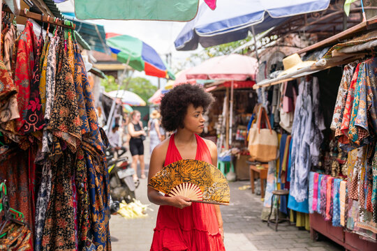 Woman Walking In Outdoor Market