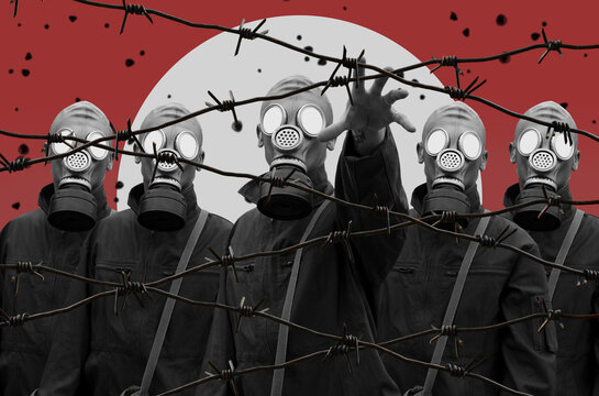 A Group Of Soldiers In Gas Masks Behind Barbed Wire