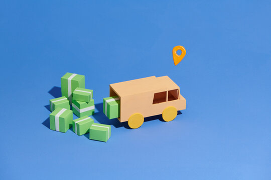stylized van for delivery with cardboard boxes and location symbol