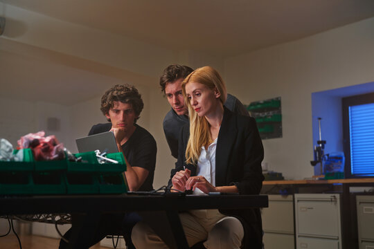 Developers working on creating a new device in an office