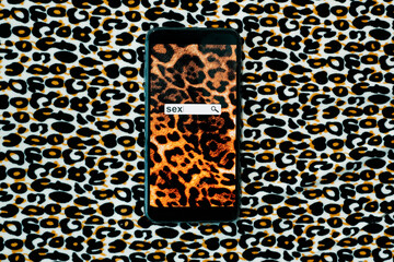 smartphone with the word sex on its screen