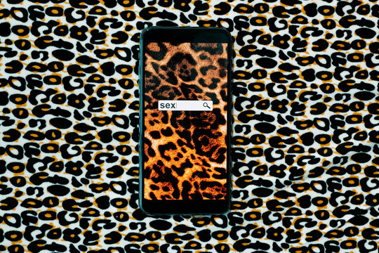 smartphone with the word sex on its screen
