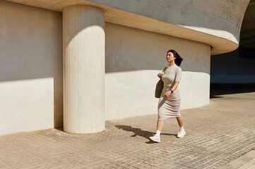 Asian woman walking on street