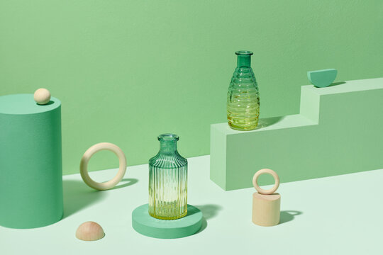 Composition with transparent vases on the podium