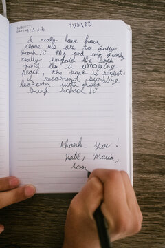 Child writes a thank you note to vacation house host