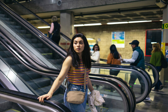 Woman entering subway station