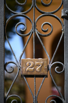 An Iron Gate With Number 27 In Charleston, South Carolina