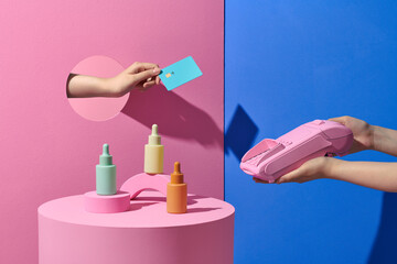 Buyer paying for purchase via terminal on color background