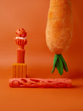 Dog toys on orange background 