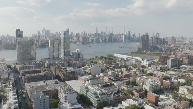 Aerial of luxury high rises in Brooklyn with Manhattan skyline views