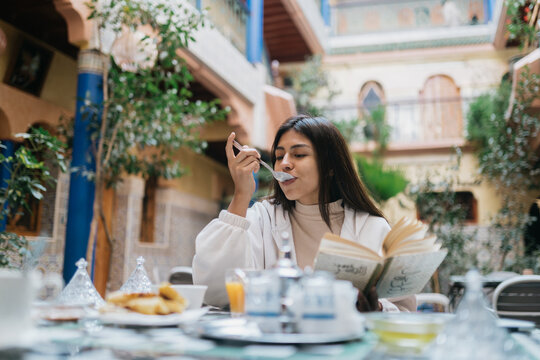 Woman having breakfast in riad