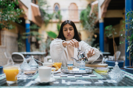 Woman having breakfast in riad