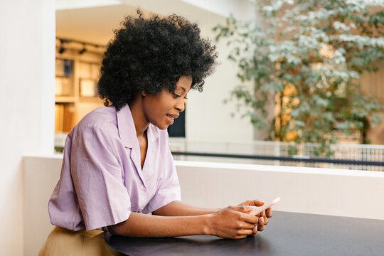 A woman communicates by video call