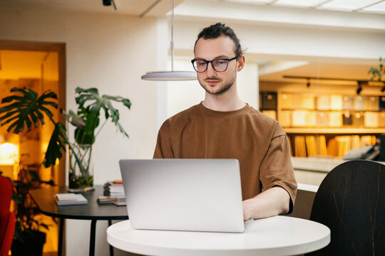 Designer works at a laptop in the interior studio 