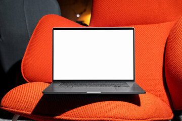 Laptop mockup on an red designer chair