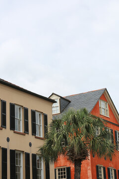 A Row Colorful Houses With Black Shutters