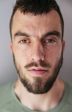 Sweaty close up portraits of bearded man.